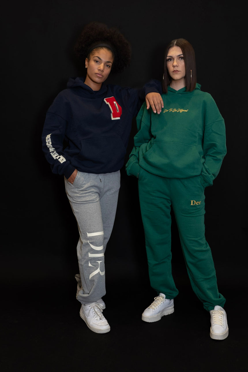 Two girls wearing our Der Tracksuits